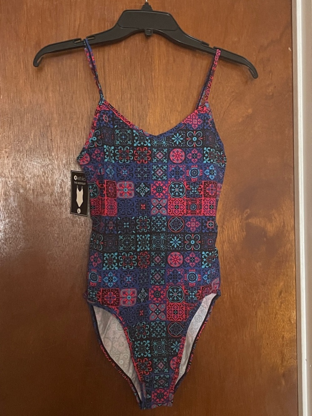 ethika Tile-Print Bodysuit in Navy, Hot Pink & Teal